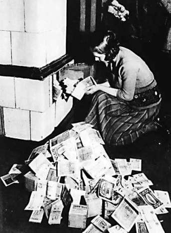 woman-burning-cash-for-heat