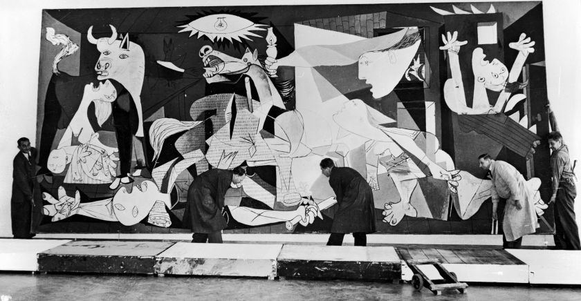 Guernica-by-Pablo-Picasso-in-Amsterdam-being-hung-in-the-Municipal-Museum-12th-July-1956.-KeystoneHulton-ArchiveGetty-Images